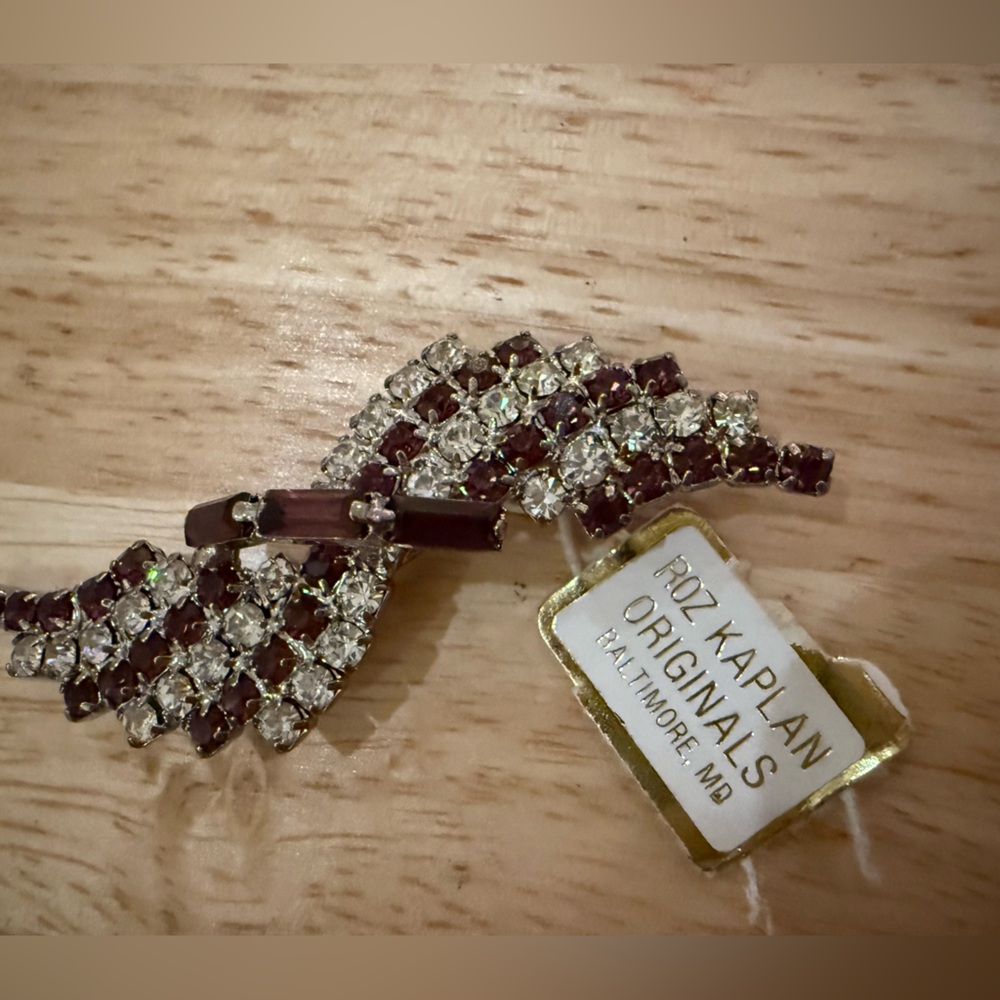 Silver Toned with purplish/brownish and clear gems Roz Kaplan Originals Brooch